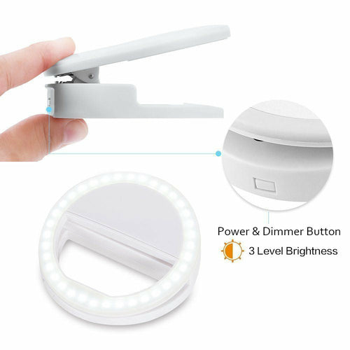 Handheld lamp with ring light and power dimmer button on a white background