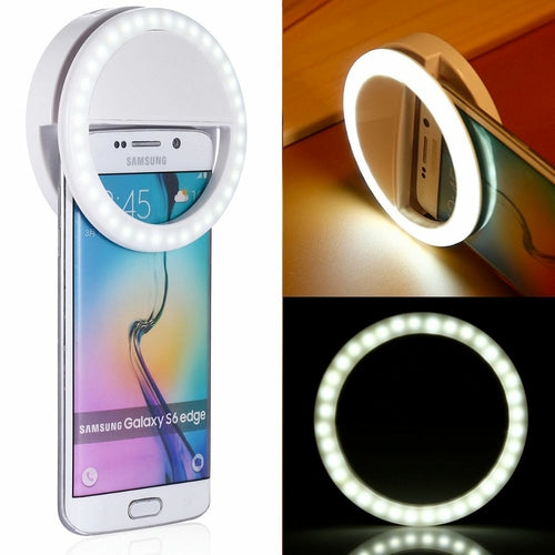 Smartphone with a ring light attachment on a white background